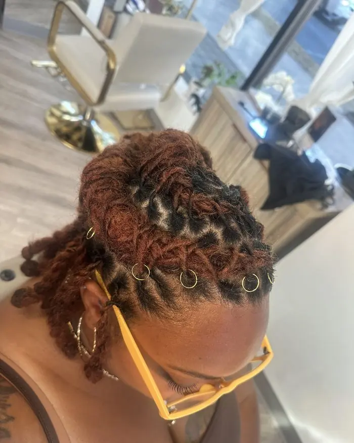 Copper locs styled into a pinned crown