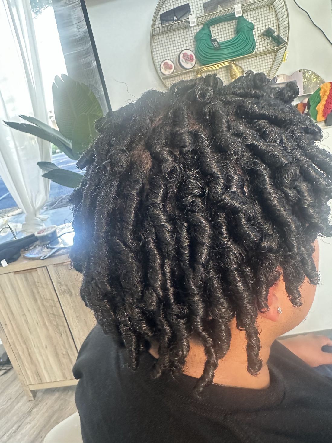 Short locs set into springy curls