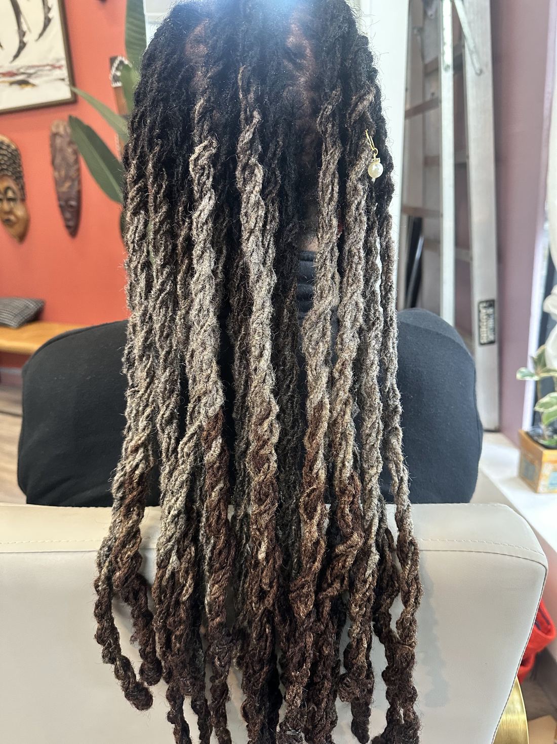 Very long locs with a sun-lightened blend toward the ends
