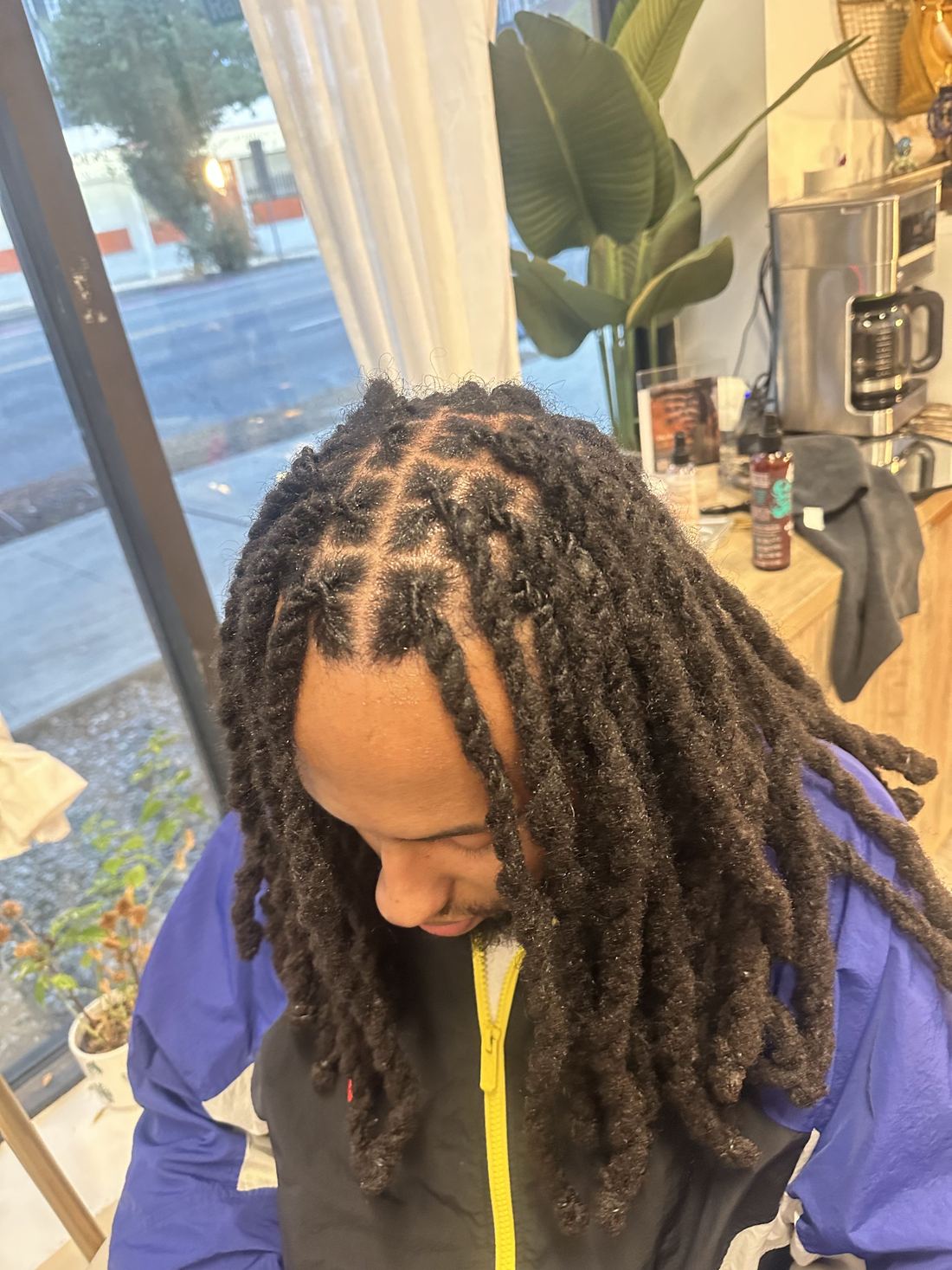 Long locs freshly retwisted with clean parts