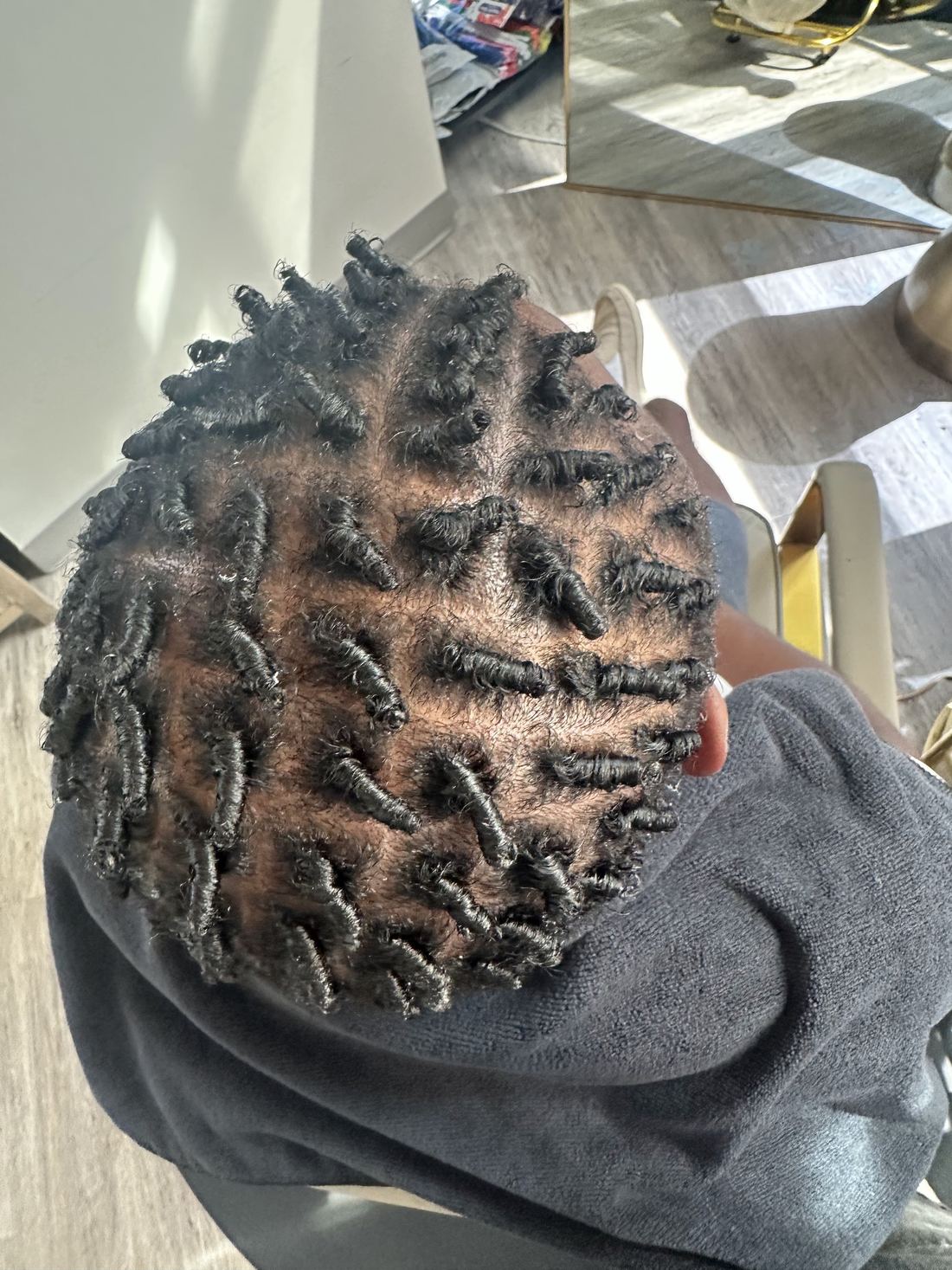 Short hair sectioned into fresh starter coils