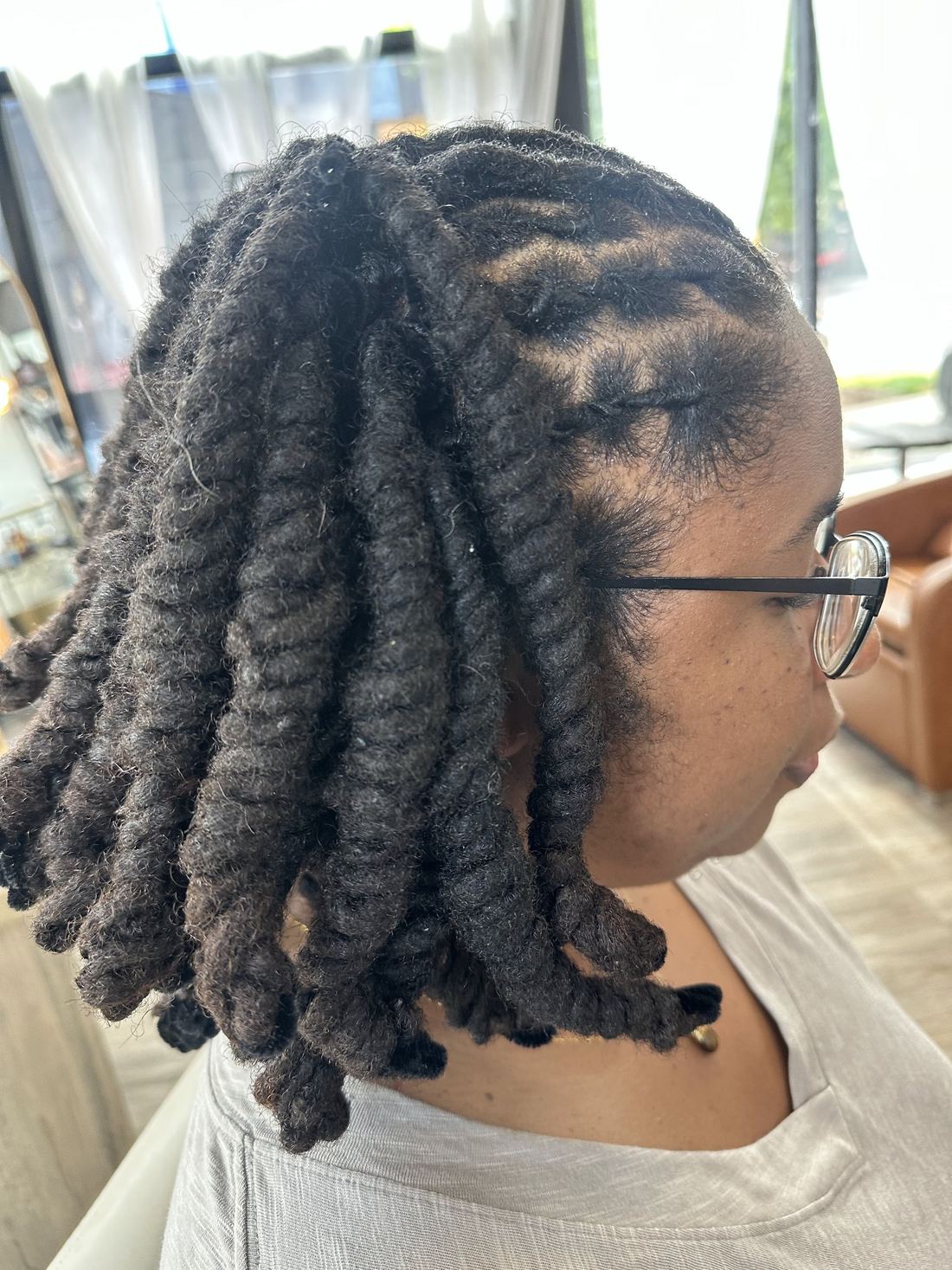 Shoulder-length locs set in chunky barrel twists